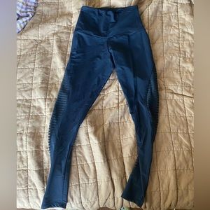 Small black athletic leggings with mesh legs